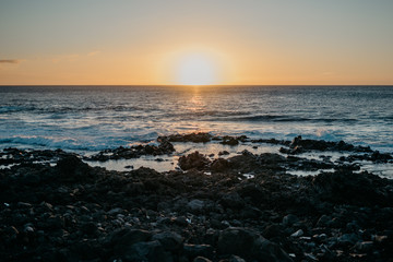 Beautiful sunset over the ocean and rocky coast. Tenerife