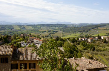 View of roofs and Tuscan landscape from Siena, Italy, 2017.