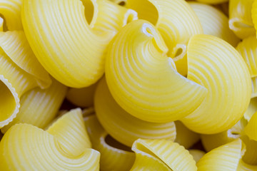 Photo of raw pasta. Pasta is photographed close-up.