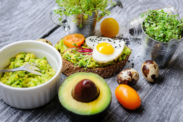 bruschetta with avocado microgrin, quail eggs and Adyghe cheese and mozzarella