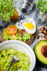 bruschetta with avocado microgrin, quail eggs and Adyghe cheese and mozzarella