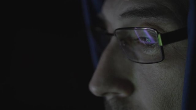 man behind the computer monitor. Internet Addiction Reflection Hacker Crime Glasses Browsing Late Night Code Cyber Terrorism Password Hacking Uhd 4K