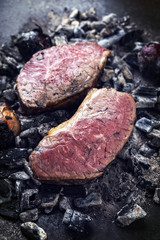 Barbecue caveman wagyu roast beef as top view on charcoal
