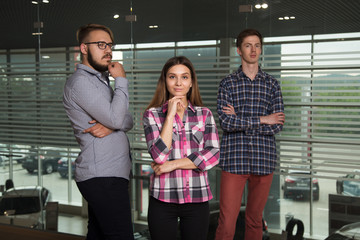 3 people work in the office, talking to, and address the issues of the company, smile and sign documents