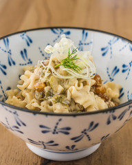 Pasta with fresh herbs, pine nuts and currants