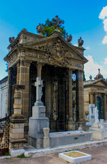 Fototapeta premium Big dark tomb surrounded by a lovely blue sky