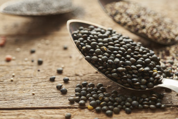 Fototapeta na wymiar close up of puy lentils on old silver spoon