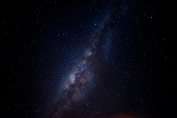 starry night sky with milky way.  image contain soft focus, blur and noise due to long expose and high iso.