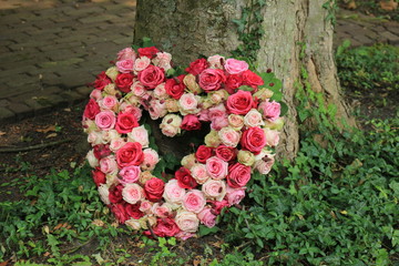Sympathy flowers near a tree