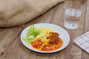 Mexican goulash with potatoes on a table