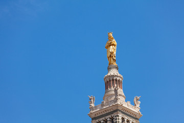 Fototapeta na wymiar Gilded statue of Virgin with child in Marseille