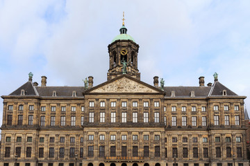 Fototapeta na wymiar View to the Royal Palace of Amsterdam, Netherlands on the Dam Square. The palace was built as a city hall during the Dutch Golden Age in the 17th century.