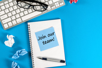 Join our team - Invitation Support Business Concept. Message at workplace with keyboard, glasses and empty space for text