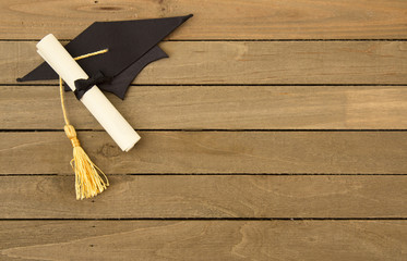 Symbols Representing Graduation on a Wooden Table