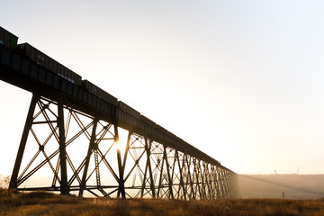 Steel train bridge stretching across a canyon