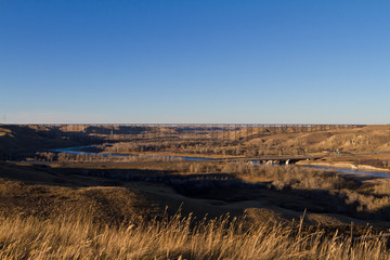 Prairie landscape with high level train bridge in background