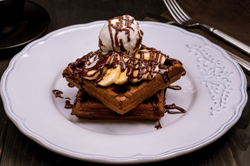 Chocolate waffle with banana and ice cream