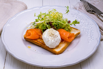 Toast with poached egg and salmon