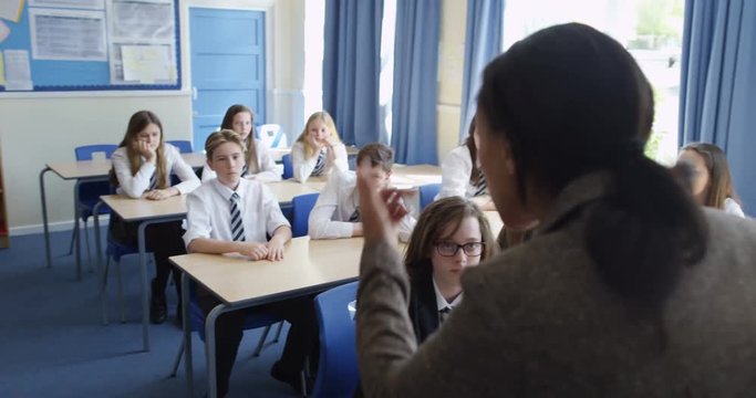 4k, Frustrated African American teacher talking students in a classroom.