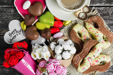 Happy International Women’s Day celebrate on March 8, congratulatory breakfast - cookie shape figure eight 8, sweets and bouquet of flowers 