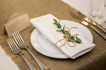 Wedding table setting in rustic style. Eco style. Wedding decoration. Table setting with a sign for the label