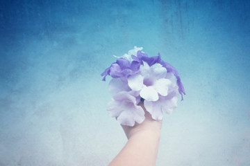 Purple flower bouquet  on hand with empty space ,abstract spring,summer,fresh nature background.