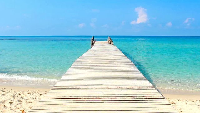 wooden walkway in the sea on tropical beach thailand