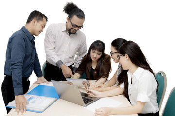 Professional business team with tablet on studio