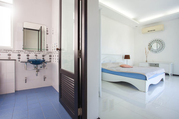 Luxury bathroom features basin, toilet bowl and bathtub