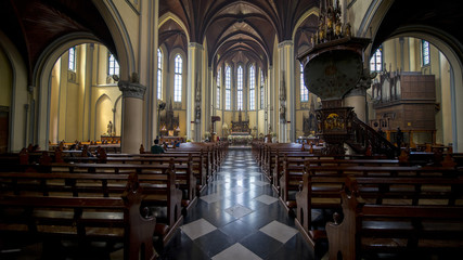 Fototapeta premium Christian tourist praying at Cathedral