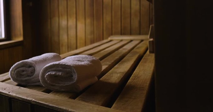 Location of a mountain wood sauna with a large window in which to relax. Concept of: interior design, relaxation, sauna, spa