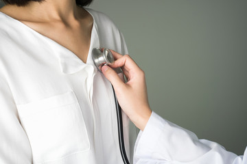 Doctor is using a stethoscope for patients patient examination. To hear the heart rate, For...
