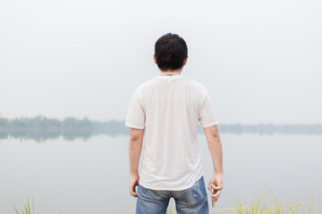 Fototapeta premium man at the blue lake