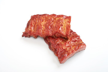 portion of delicious spicy marinated pork ribs isolated on white background.