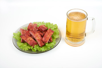 Grilled pork ribs and beer isolated on white background