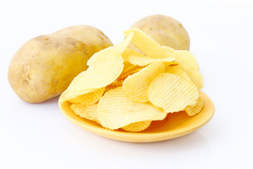 Potato chips on wooden plate