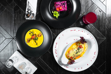 Set dinner of three courses. Chef's specialty presented in restaurant on served table. Clouse up.