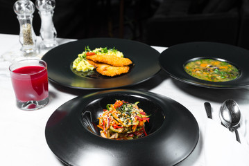 Set dinner of three courses. Chef's specialty presented in restaurant on served table. Clouse up.