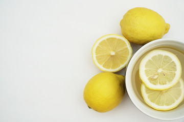 Hot lemon tea isolated on a white background.