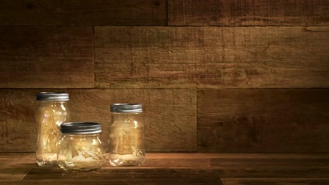 This is a video of fireflies or lightning bugs dancing inside glass jars on an old wood retro background. This video would work well for summertime worship.

