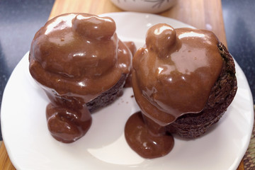 couple of chocolate cupcakes decoareted with chocolate
