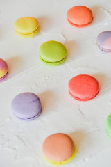 multicolored macaroons on light background, geometric layout