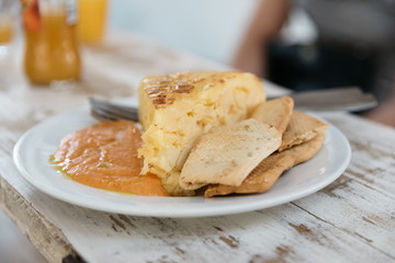 Close up of plate of spanish omelette with salmorejo, a typical