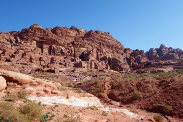 Fototapeta premium Panoramic view of Rock cut tombs in the ancient Arab Nabatean Kingdom city of Petra, Jordan, Middle East
