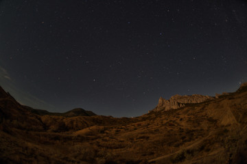 Fototapeta na wymiar Rocks of the extinct volcano Karadag in the Crimea in night