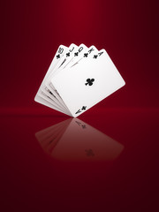 some poker cards on a background red
