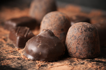 Assorted dark chocolate candies close-up