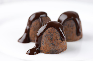 Chocolate truffles with chocolate sauce