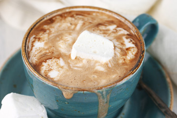Hot coffee with whipped cream and marshmallow