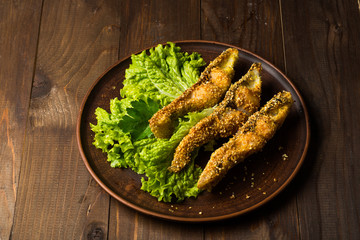 Tasty baked fish on plate  table close-up
